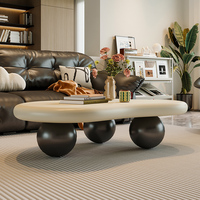 Table Basse Nuage Nordique Minimaliste et Luxueuse Crème Blanc Unique et Élégante avec Piétement Sphérique Noir