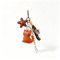 Breloque de sac en similicuir Sienna avec silhouette de chat et pendentif étoile brodé, attache tressée raffinée pour sac à dos et décoration de sac de transport