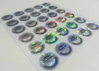 Étiquette autocollante personnalisée en PET argenté bleu circulaire, résistante à l'eau et aux UV, avec laser anti-contrefaçon pour emballage d'écouteurs