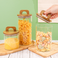 Pot alimentaire rond en verre transparent de 700 ml, 1000 ml, 1400 ml avec bouchon en bois et poignée pour le stockage de friandises, bonbons et biscuits