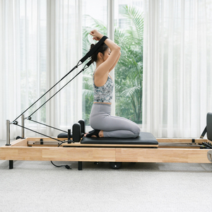 Équipement de Pilates personnalisé directement de l'usine, Reformer Pilates pliable en bois de chêne de haute qualité - Product Image 1