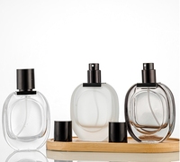 Botella de perfume de repuesto de vidrio transparente esmerilado 30ml reciclable de lujo con tapa de pulverización de bomba negra