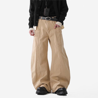 Pantalon décontracté homme en toile de coton à jambe large, style streetwear rétro américain, patchwork, déstructuré, utilitaire, avec fermeture éclair, vente en gros
