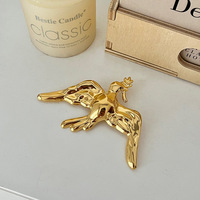 Broches en acier inoxydable doré et argenté pour femmes, épingles de revers de luxe en forme de cœur irrégulier, d'hirondelle et de conque, accessoires de décoration vestimentaire, vente en gros