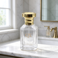 Vente en gros de flacons de parfum en verre transparent blanc cristal de 30 ml avec bouchon en métal doré brillant pour emballages de parfums de luxe