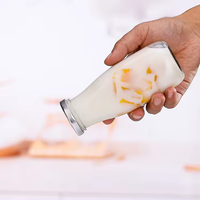 Boisson potable 300ml bouteille en verre carrée transparente avec couvercle en métal torsadé pour saveur de boisson de jus