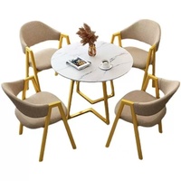 Table à manger moderne en pierre frittée à pieds en métal Mobilier de maison imperméable et non toxique
