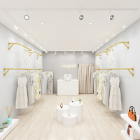 Présentoir mural de vêtements en métal doré de luxe Boutique Magasin de vêtements Supports de rangement de vêtements