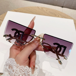 Fashion Frameless Cut Edge Oversized <b>Sunglasses</b> With Hollow Letter Design For Women UV400 Protection Metal Frame PC Lens - Product Image 1