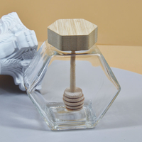 Bocaux en verre hexagonaux de haute qualité de 100 ml, 220 ml et 380 ml avec couvercles en bois pour le stockage du miel, des bonbons et du sucre