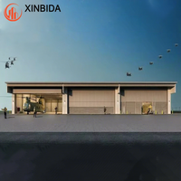 Hangar préfabriqué en structure métallique avec conception personnalisée, entrepôt à prix avantageux pour hélicoptères et avions privés