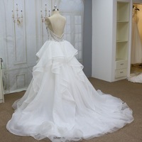 Robe de mariée de luxe moderne, richement ornée de perles, longue jusqu'au sol, avec des cristaux, des paillettes, des volants en organza, robe de bal