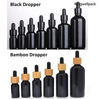 Flacon compte-gouttes en verre noir personnalisé de 5ml 10ml 15ml 20ml 30ml 50ml 100ml huile essentielle flacon en verre violet foncé avec pompe