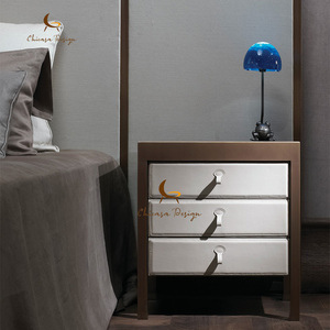 Brass Metal Trim Designer Bedroom Furniture Elegant Leather Upholstered Dresser Contemporary Minimalist Chest Drawers Nightstand - Product Image 1