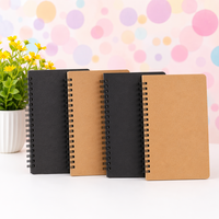 Carnet de notes A5 noir à spirale double avec couverture rigide, personnalisable avec logo, idéal pour l'école, le bureau, la promotion d'entreprise ou comme cadeau.