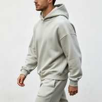 Sweat-shirt surdimensionné à capuche pour homme, style streetwear vintage, design personnalisé avec logo sur le devant, tissu en coton 100% éponge, respectueux de l'environnement