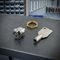 Serrure à poussoir tubulaire en zinc moulé sous pression avec finition chromée et clé en laiton nickelé, diamètre 12 mm/15,8 mm.