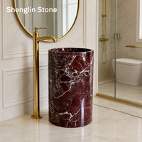 Lavabo sur pied cylindrique en marbre Rosso Levanto pour salle de bain de luxe, hôtel ou villa