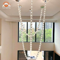 Lustre cascade personnalisé en grandes perles de cristal, suspension moderne en cristal pour escalier, hall d'hôtel, villa de luxe