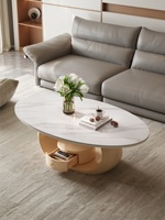 Nouvelle table basse en bois massif, design minimaliste moderne, plateau en dalle de pierre ovale, rangement intégré, luxe discret pour salon