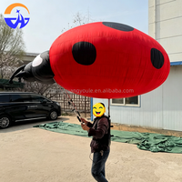 Costume de mascotte portable en forme de coccinelle gonflable en tissu Oxford avec ventilateur intégré pour défilés et parcs d'attractions