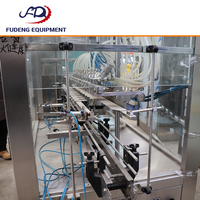 En stock, stock limité : Machine de remplissage linéaire automatique ZHGA, remplisseur submersible à 12 têtes, faible nombre d'heures de fonctionnement, en acier inoxydable 316.