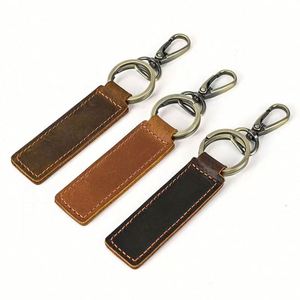 <b>Custom</b> Brand Luxury Leather <b>Keychain</b> with Retro Double Circle Design Popular Retro Metal PU Accessories Rectangular Logo Imprint - Product Image 1