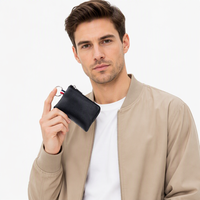 Porte-monnaie mini en cuir noir de luxe avec fermeture éclair, porte-cartes de crédit, étui pour écouteurs, pochette porte-clés portable