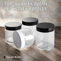 Botol Remas sirup madu plastik bulat 200ml/280g kualitas tinggi diskon besar dengan tutup sekrup untuk penyimpanan gula Salad cokelat