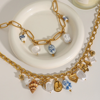 Colliers J&D style océan d'été en acier inoxydable plaqué or 18 carats avec breloques DIY coquillages, céramique, corail, étoiles de mer et perles