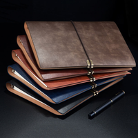 Cahier à bretelles rétro vendu à chaud avec logo personnalisé Cahier A5. Carnet à feuilles mobiles détachable en cuir souple de qualité professionnelle.