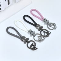 Porte-clés mignon en forme de tête d'ours tressé en cuir avec mousqueton, corde en PU colorée, anneau en alliage de zinc, pour femmes et couples, tendance et écologique