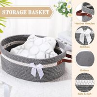 Petit panier de rangement en corde de coton tressée avec poignée en ruban, design rond moderne et minimaliste pour étagère, jouet pour chat et cadeau pour bébé