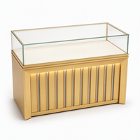 Vitrine de présentation de bijoux sur mesure en gros avec éclairage LED, finition dorée et verre haute transparence