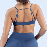 Soutien-gorge de sport sans couture à maintien moyen en Spandex/Nylon, design push-up à nouer devant, bretelles élégantes, dos flatteur pour ODM OEM