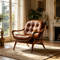 Fauteuil de détente en cuir marron capitonné avec structure en bois de noyer massif pour un espace de vie résidentiel vintage et rétro