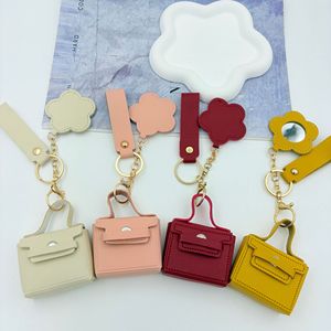 Mini porte-monnaie porte-clés en forme de <span class=keywords><strong>sac</strong></span> <span class=keywords><strong>à</strong></span> dos, breloque de <span class=keywords><strong>sac</strong></span> de créateur, mignon, en cuir PU, pochette <span class=keywords><strong>à</strong></span> monnaie, pendentif pour <span class=keywords><strong>sac</strong></span> <span class=keywords><strong>à</strong></span> main avec miroir floral - Product Image 1