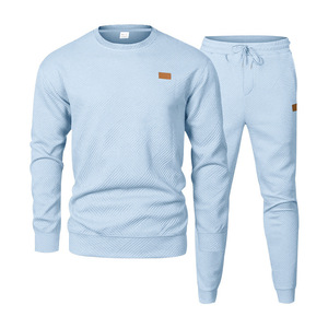 Traje deportivo y de ocio para hombres europeos y americanos Suéter de Jacquard de cuello redondo LOGOTIPO personalizado de dos piezas - Product Image 1