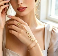 Bracelet XUPING en acier inoxydable couleur or 14 carats, motif fleur ajourée, avec anneau de doigt intégré, bijoux de mode pour femme