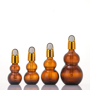 Fabrik preis Probe Kostenlos 10ml 20ml 30ml Doppel kürbis form Bernstein ätherisches Öl Glas Tropf flasche mit Gold Blumen korb kappe - Product Image 3