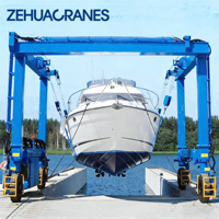 Grue portique mobile hydraulique sur pneus en caoutchouc sur mesure pour levage de yachts, idéale pour la mise en eau et l'entretien de bateaux en marina et en chantier naval