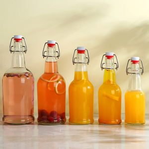 Venta al por mayor <span class=keywords><strong>caliente</strong></span> <span class=keywords><strong>de</strong></span> encargo <span class=keywords><strong>de</strong></span> oscilación superior redonda 250ml 500ml 8 oz 16 oz 32 oz Flip top <span class=keywords><strong>de</strong></span> vidrio transparente botellas <span class=keywords><strong>de</strong></span> Kombucha para Kombucha - Product Image 2