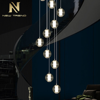 Lustre suspendu en cristal LED de luxe sur mesure pour la décoration intérieure de villas, hôtels, halls d'entrée, chambres et escaliers
