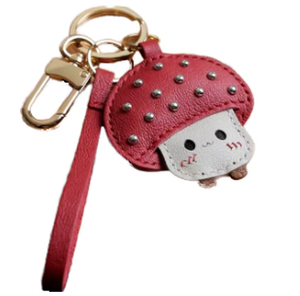 Breloque en cuir véritable en forme de champignon mignon : accessoire en cuir créatif pour mettre en valeur les détails charmants des sacs et des clés - Product Image 1