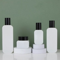 Vente en gros de pots en verre blanc vides pour crème avec couvercle noir, contenants cosmétiques rechargeables, emballage personnalisé avec logo