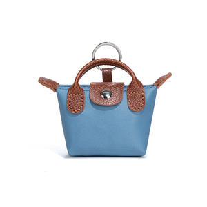 Nouveau <span class=keywords><strong>porte</strong></span>-<span class=keywords><strong>monnaie</strong></span> en forme <span class=keywords><strong>de</strong></span> boulette avec lanières <span class=keywords><strong>de</strong></span> bracelet pochette <span class=keywords><strong>porte</strong></span>-<span class=keywords><strong>monnaie</strong></span> en cuir PU avec <span class=keywords><strong>porte</strong></span>-clés Offre Spéciale pendentif MIniBag - Product Image 2