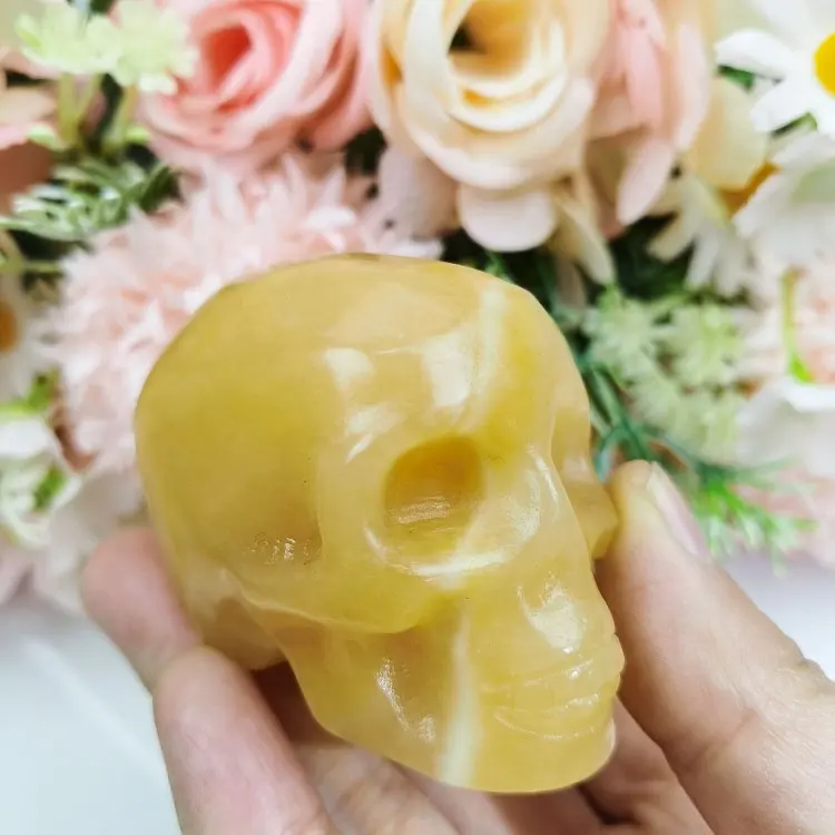 Crânios de cristal natural para escultura em pedra de cura polida, caveiras de calcita amarela
