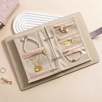 Carnet de rangement pour bijoux en cuir PU, organisateur portable avec pochettes zippées pour colliers, boucles d'oreilles, bagues et bracelets