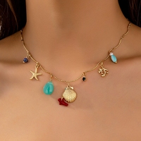 Colliers de style bohème pour femme, idéal pour l'été et la plage, avec étoiles de mer, coquillages, breloques thème vie marine, perles artificielles et corail, style bouddhiste