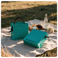 Sacs en papier bleus personnalisés avec nœud latéral, sacs de shopping en papier rayé enduit avec logo imprimé pour emballage cadeau, vente en gros